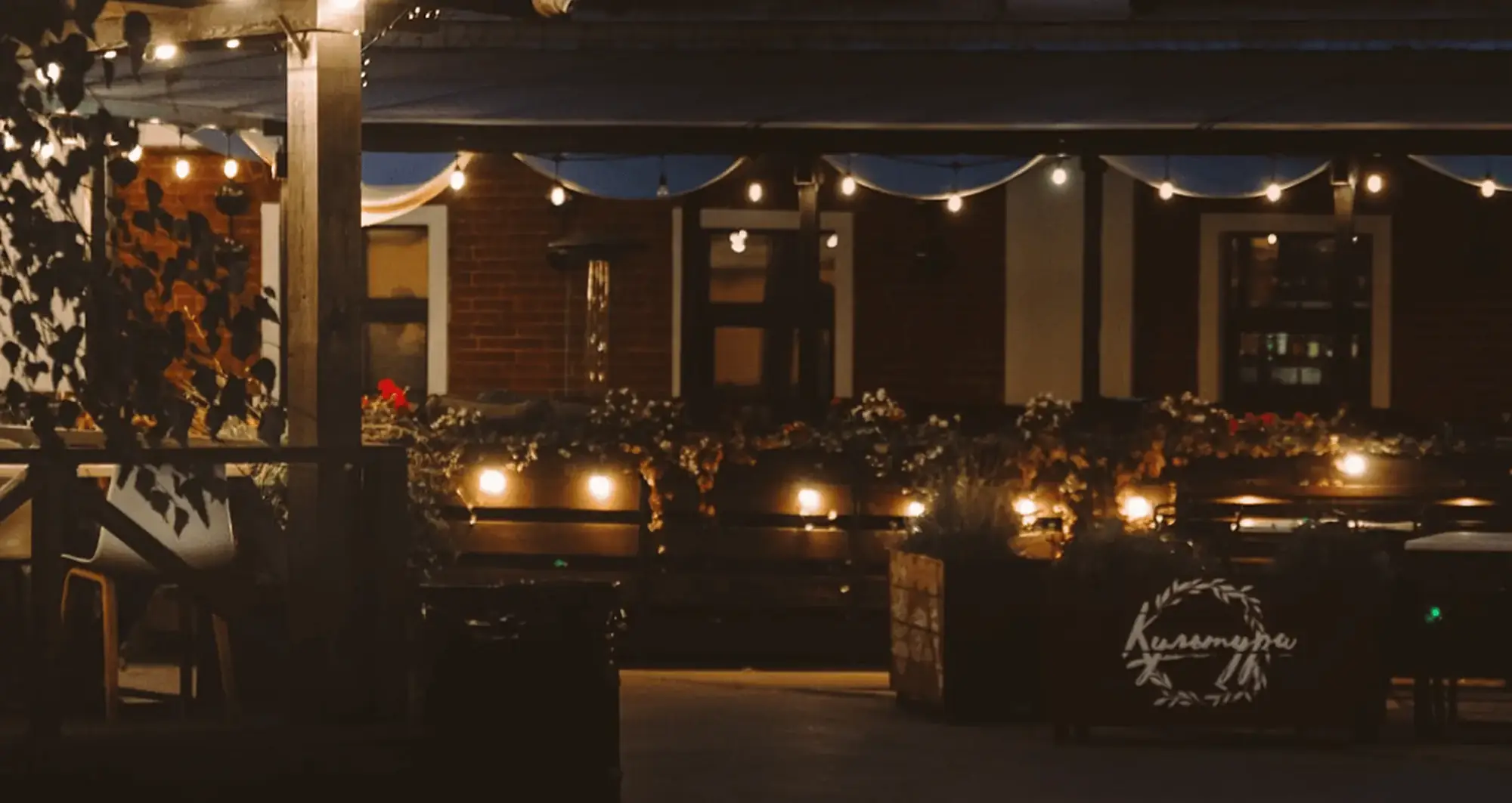 Restaurant terrace with string lights, set up for a corporate Christmas party in Prague